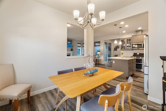 3215 64th Ln SW, Olympia, WA 98512 - dining area with recessed lighting, dark wood-style flooring, baseboards, and a notable chandelier