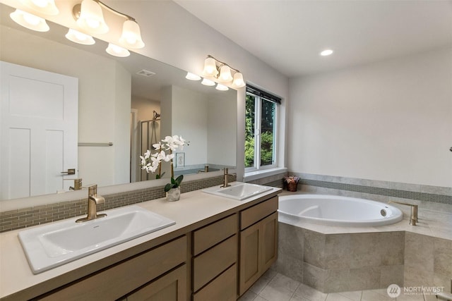 3215 64th Ln SW, Olympia, WA 98512 - bathroom with a sink, double vanity, a bath, and visible vents
