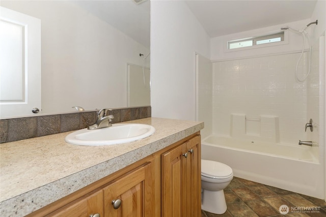 full bathroom with toilet, vanity, and shower / bath combination