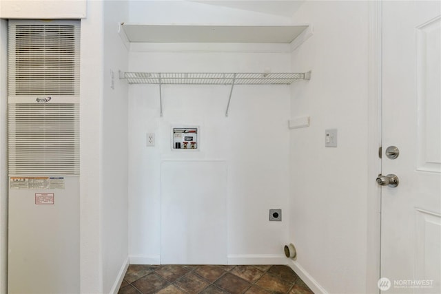 washroom with a heating unit, hookup for an electric dryer, baseboards, and hookup for a washing machine