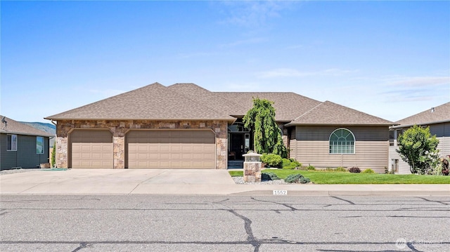 1552 Huntwood Ln, East Wenatchee, WA 98802 - view of front of property featuring an attached garage, concrete driveway, a shingled roof, and a front yard