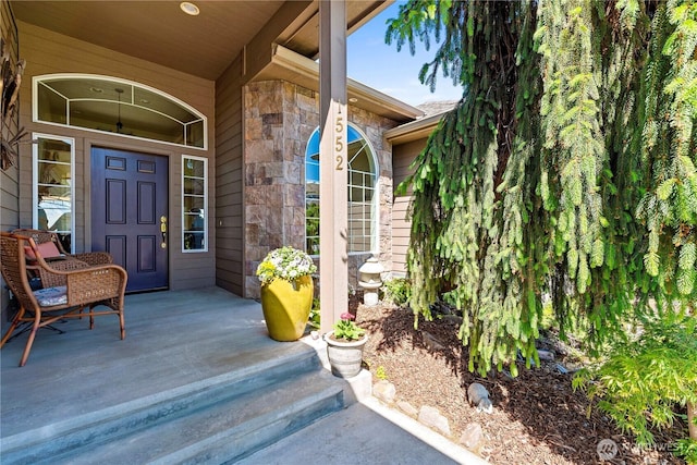 1552 Huntwood Ln, East Wenatchee, WA 98802 - property entrance featuring stone siding and a porch