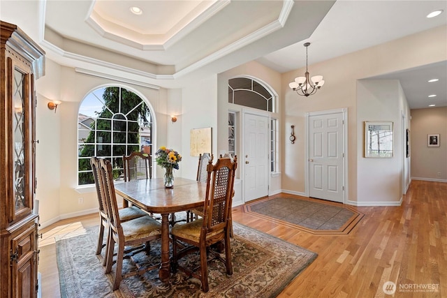 1552 Huntwood Ln, East Wenatchee, WA 98802 - dining area with a chandelier, light wood finished floors, baseboards, a tray ceiling, and recessed lighting