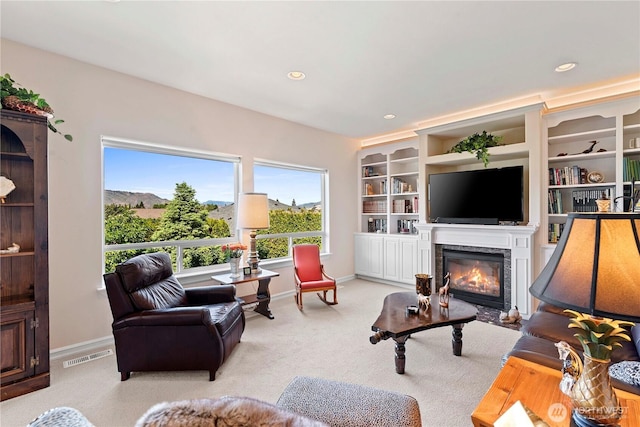 1552 Huntwood Ln, East Wenatchee, WA 98802 - carpeted living room with a glass covered fireplace, baseboards, and recessed lighting