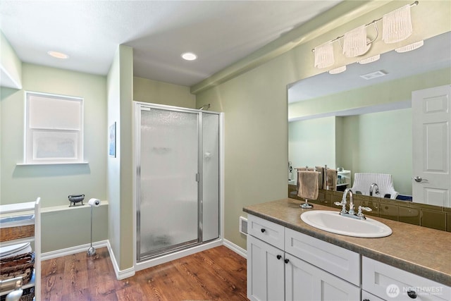 1552 Huntwood Ln, East Wenatchee, WA 98802 - bathroom featuring wood finished floors, a shower stall, vanity, recessed lighting, and baseboards