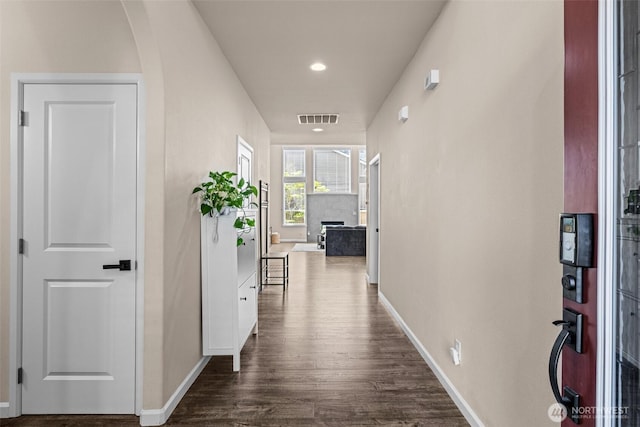 4002 33rd St NE, Tacoma, WA 98422 - hallway with dark wood-style floors, baseboards, arched walkways, and recessed lighting