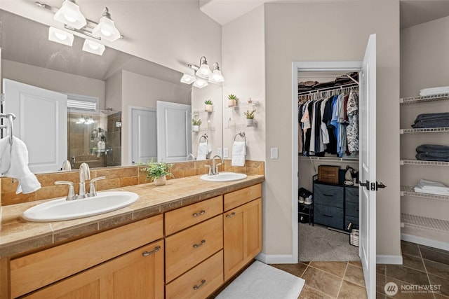 4002 33rd St NE, Tacoma, WA 98422 - full bath with a shower stall, double vanity, a walk in closet, tile patterned floors, and baseboards