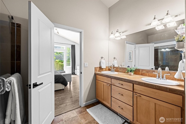 4002 33rd St NE, Tacoma, WA 98422 - ensuite bathroom featuring lofted ceiling, double vanity, baseboards, and tiled shower