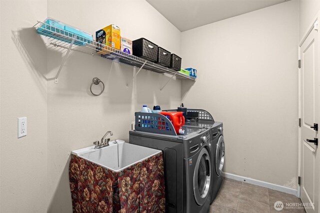 4002 33rd St NE, Tacoma, WA 98422 - clothes washing area with baseboards, separate washer and dryer, and light tile patterned floors