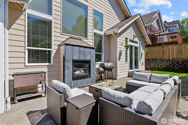 4002 33rd St NE, Tacoma, WA 98422 - view of patio featuring an outdoor living space with a fireplace, fence, and area for grilling