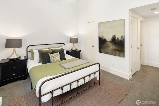 carpeted bedroom featuring baseboards