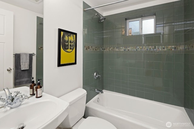 full bathroom featuring a sink, toilet, and shower / tub combination