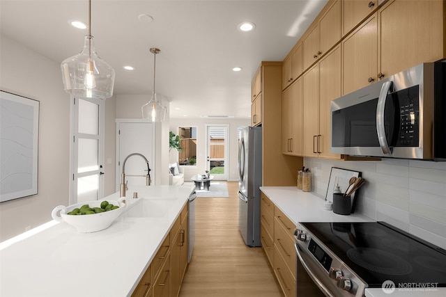 10604 NE 137th Pl, Kirkland, WA 98034 - kitchen featuring appliances with stainless steel finishes, a sink, light brown cabinets, backsplash, and recessed lighting