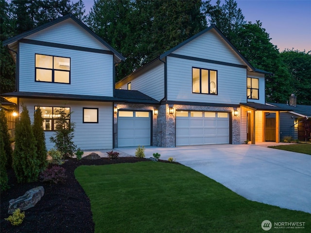 10604 NE 137th Pl, Kirkland, WA 98034 - contemporary home with concrete driveway, a front yard, and an attached garage