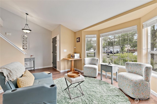 17915 69th Avenue Ct E, Puyallup, WA 98375 - living room with wood finished floors, baseboards, and high vaulted ceiling