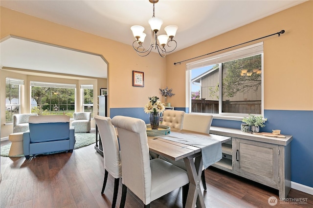 17915 69th Avenue Ct E, Puyallup, WA 98375 - dining space featuring a chandelier, dark wood-type flooring, and baseboards
