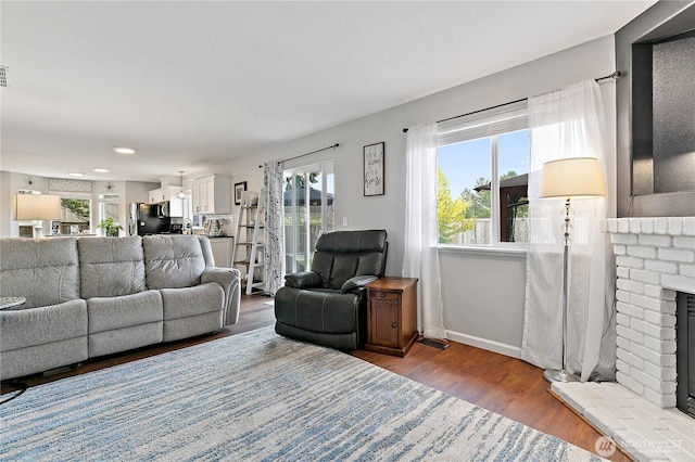 17915 69th Avenue Ct E, Puyallup, WA 98375 - living room featuring wood finished floors, a fireplace, baseboards, and recessed lighting