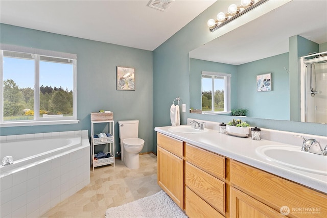 17915 69th Avenue Ct E, Puyallup, WA 98375 - bathroom featuring double vanity, a shower with door, toilet, and a bath
