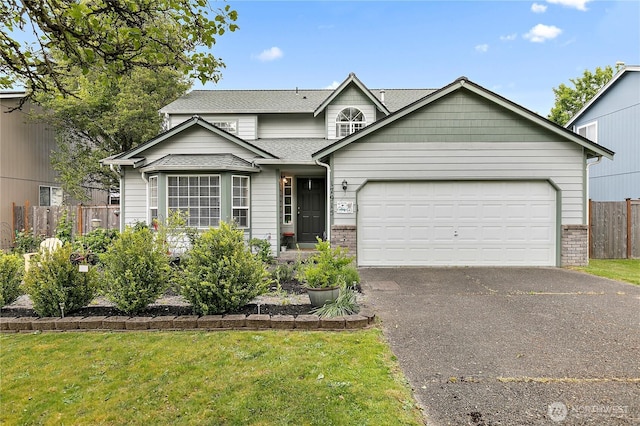 17915 69th Avenue Ct E, Puyallup, WA 98375 - traditional-style home featuring asphalt driveway, a garage, roof with shingles, and brick siding