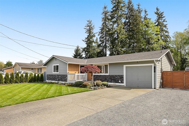 ranch-style home featuring an attached garage, concrete driveway, and stone siding