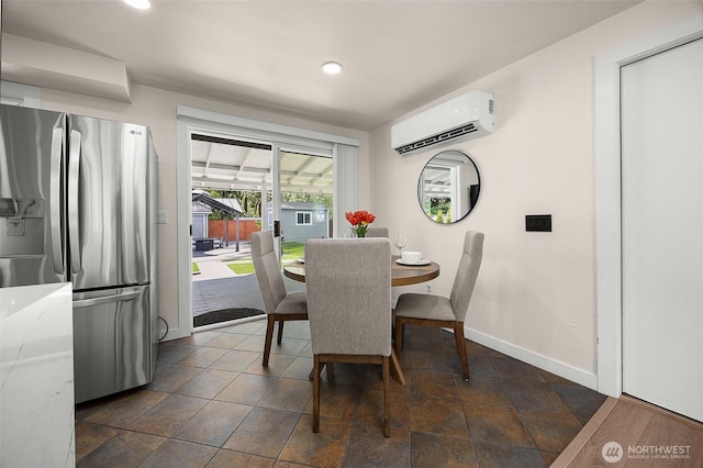 dining room featuring a wall mounted AC, baseboards, and recessed lighting