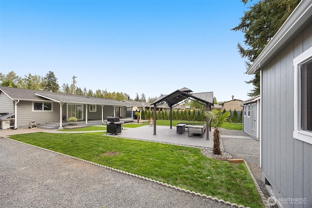 view of green lawn with a patio and a gazebo