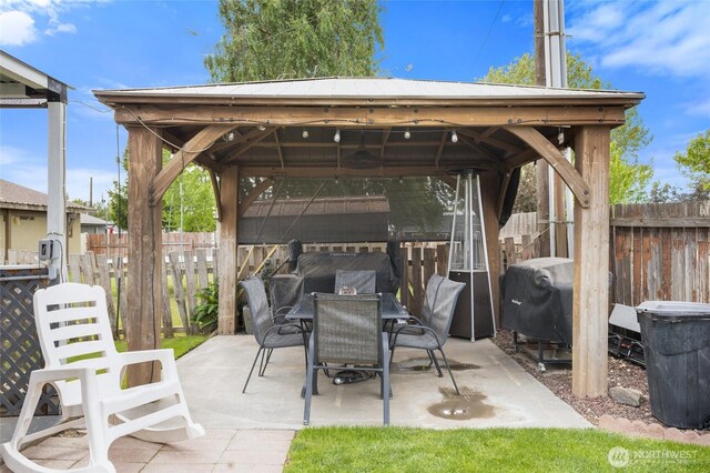 322 W 8th St, Warden, WA 98857 - view of patio / terrace featuring a gazebo, fence, outdoor dining area, and grilling area
