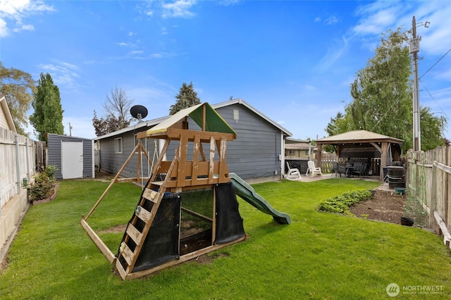 322 W 8th St, Warden, WA 98857 - view of play area with a gazebo, a storage shed, a patio, and an outdoor structure