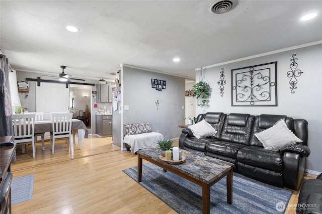 322 W 8th St, Warden, WA 98857 - living room with crown molding, light wood-style floors, a ceiling fan, and recessed lighting