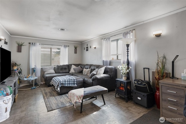 322 W 8th St, Warden, WA 98857 - living area featuring plenty of natural light, crown molding, and a wood stove
