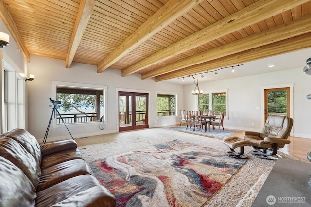1005 Cavalero Rd, Camano Island, WA 98282 - living room featuring wooden ceiling, baseboards, and beam ceiling