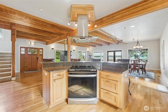 1005 Cavalero Rd, Camano Island, WA 98282 - kitchen featuring light wood-type flooring, light brown cabinetry, beamed ceiling, and electric range