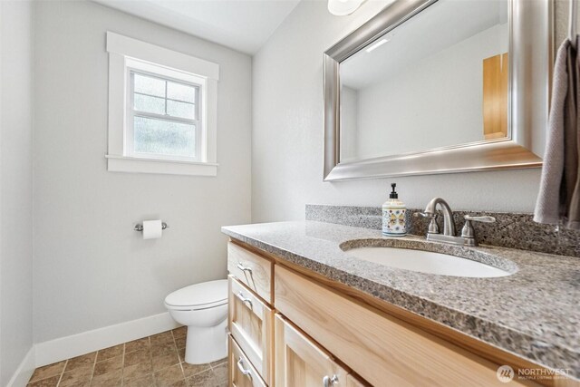 1005 Cavalero Rd, Camano Island, WA 98282 - bathroom with vanity, toilet, and baseboards