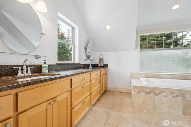 1005 Cavalero Rd, Camano Island, WA 98282 - bathroom featuring a sink, tile patterned flooring, baseboards, and a healthy amount of sunlight