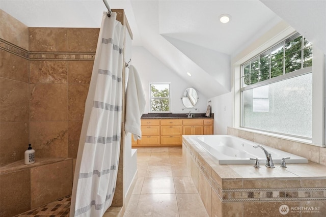 1005 Cavalero Rd, Camano Island, WA 98282 - bathroom with a tile shower, a wealth of natural light, a jetted tub, and vaulted ceiling