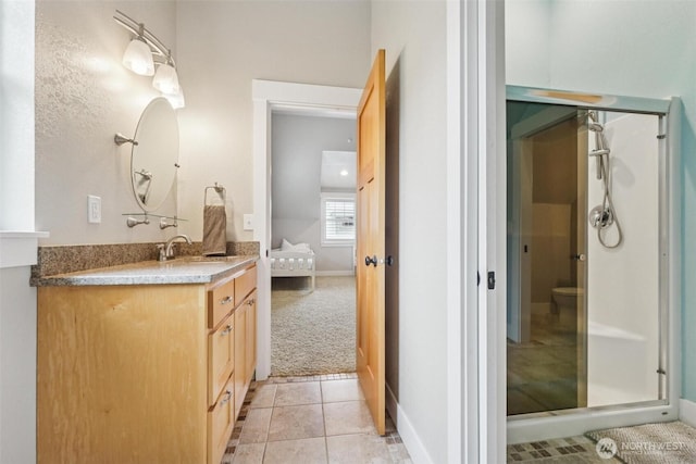 1005 Cavalero Rd, Camano Island, WA 98282 - bathroom with a shower stall, tile patterned flooring, vanity, and baseboards