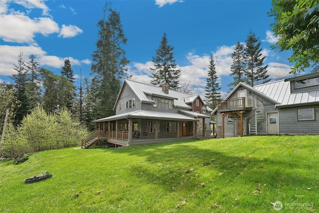 1005 Cavalero Rd, Camano Island, WA 98282 - back of house with metal roof, stairs, a standing seam roof, and a yard