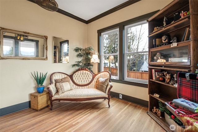 640 N Elm St, Colville, WA 99114 - living area featuring crown molding, wood finished floors, and baseboards