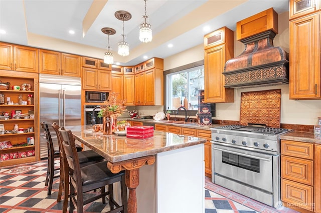 640 N Elm St, Colville, WA 99114 - kitchen featuring light floors, built in appliances, a raised ceiling, and a sink