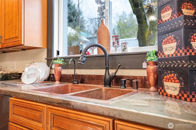 640 N Elm St, Colville, WA 99114 - details featuring wet bar, brown cabinetry, and a sink