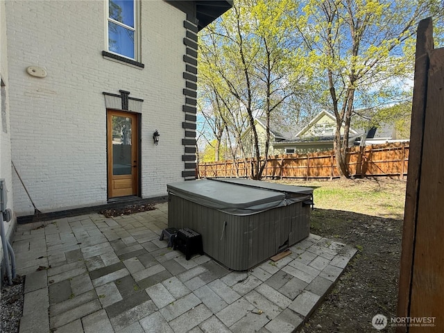 640 N Elm St, Colville, WA 99114 - view of patio with a hot tub and a fenced backyard