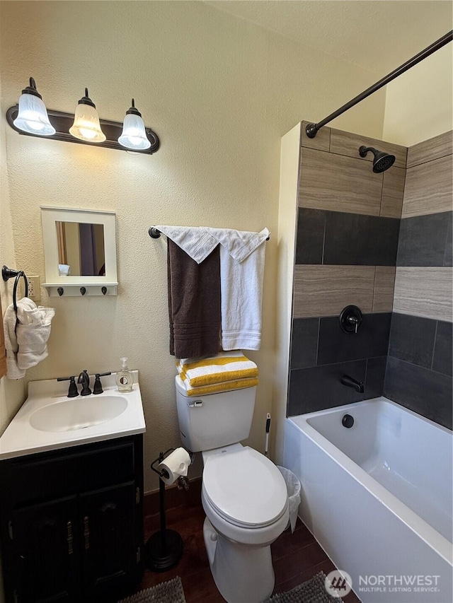 640 N Elm St, Colville, WA 99114 - bathroom featuring toilet, vanity, and bathtub / shower combination