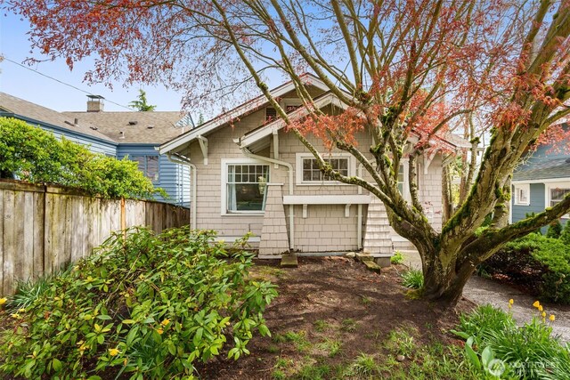 back of property with fence