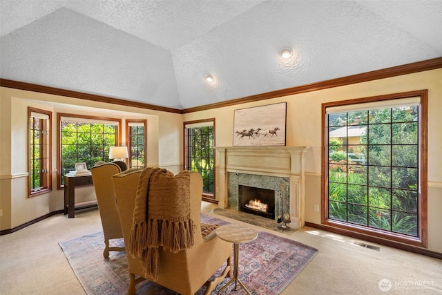 7117 NE 176th Ave, Vancouver, WA 98682 - living area with carpet floors, a textured ceiling, lofted ceiling, a fireplace, and ornamental molding