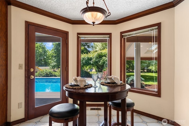 7117 NE 176th Ave, Vancouver, WA 98682 - dining room featuring plenty of natural light, crown molding, and a textured ceiling