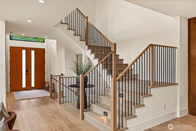 8458 NE 9th St, Medina, WA 98039 - entrance foyer featuring wood finished floors, recessed lighting, stairway, and baseboards