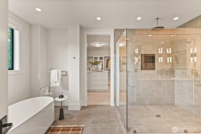 8458 NE 9th St, Medina, WA 98039 - bathroom featuring a stall shower, a soaking tub, recessed lighting, and tile patterned floors