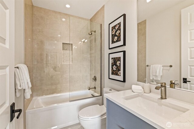 8458 NE 9th St, Medina, WA 98039 - bathroom featuring vanity, toilet, and bathtub / shower combination