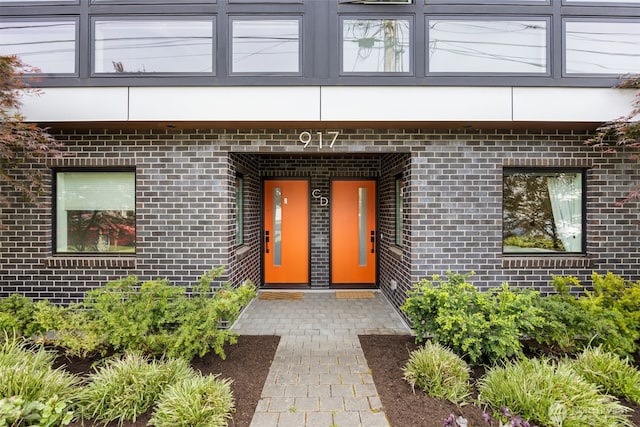 entrance to property with brick siding