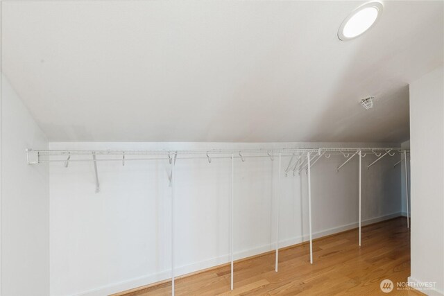 418 11th Ave E Unit B, Seattle, WA 98102 - walk in closet featuring wood finished floors